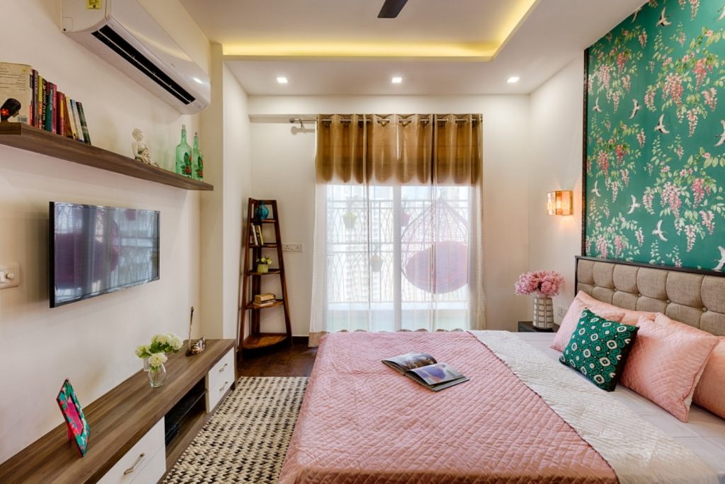 Uncluttered Indian bedroom design & décor with wooden floor interrupted by ethnic-print tiles